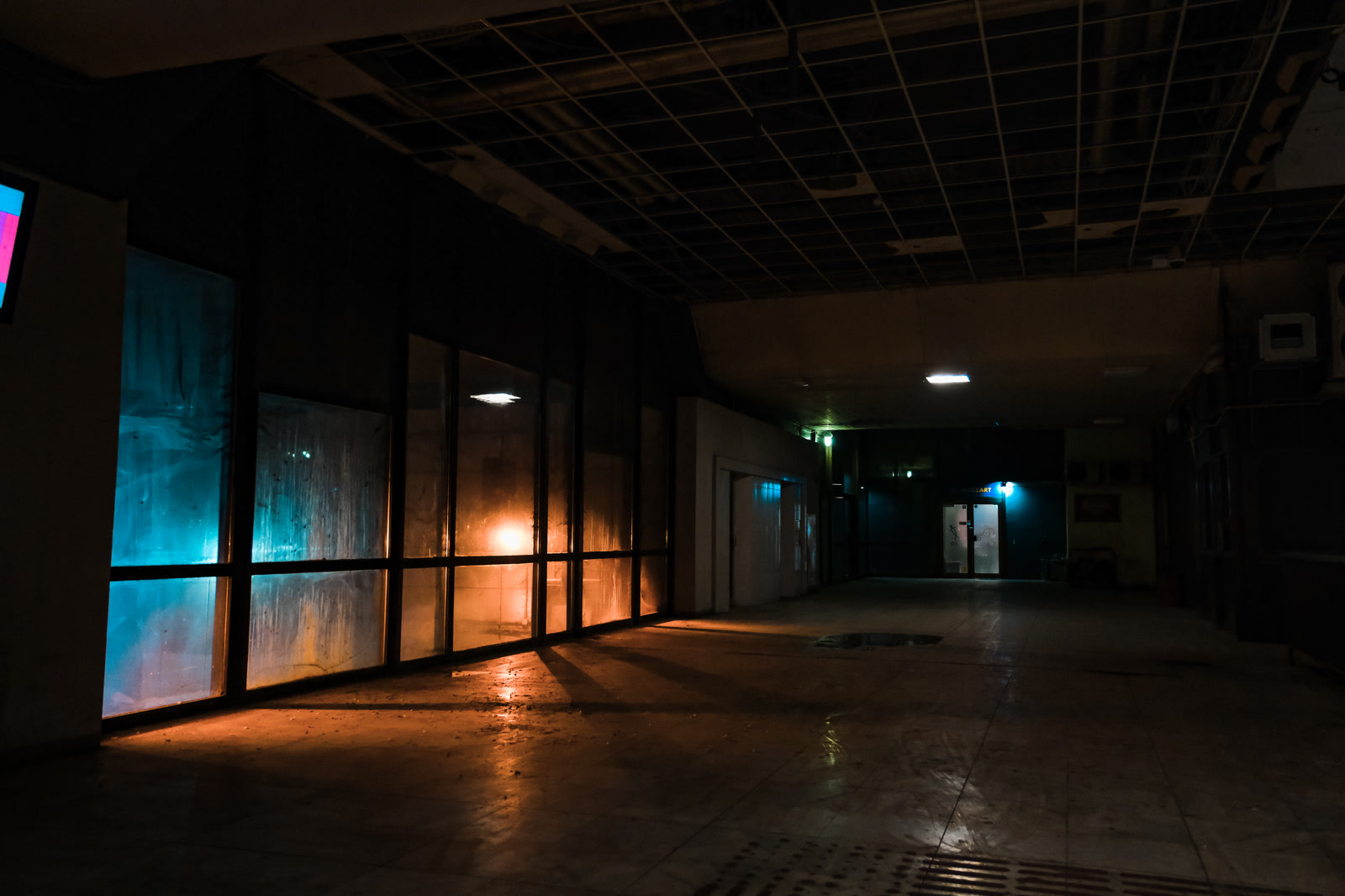 Empty hall lit blue and amber