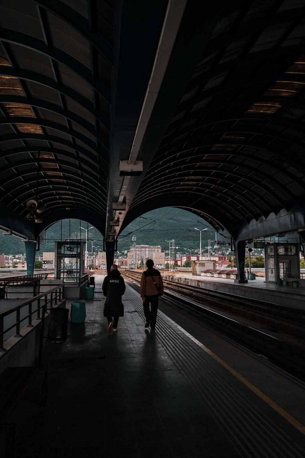 Figures on a covered station platform