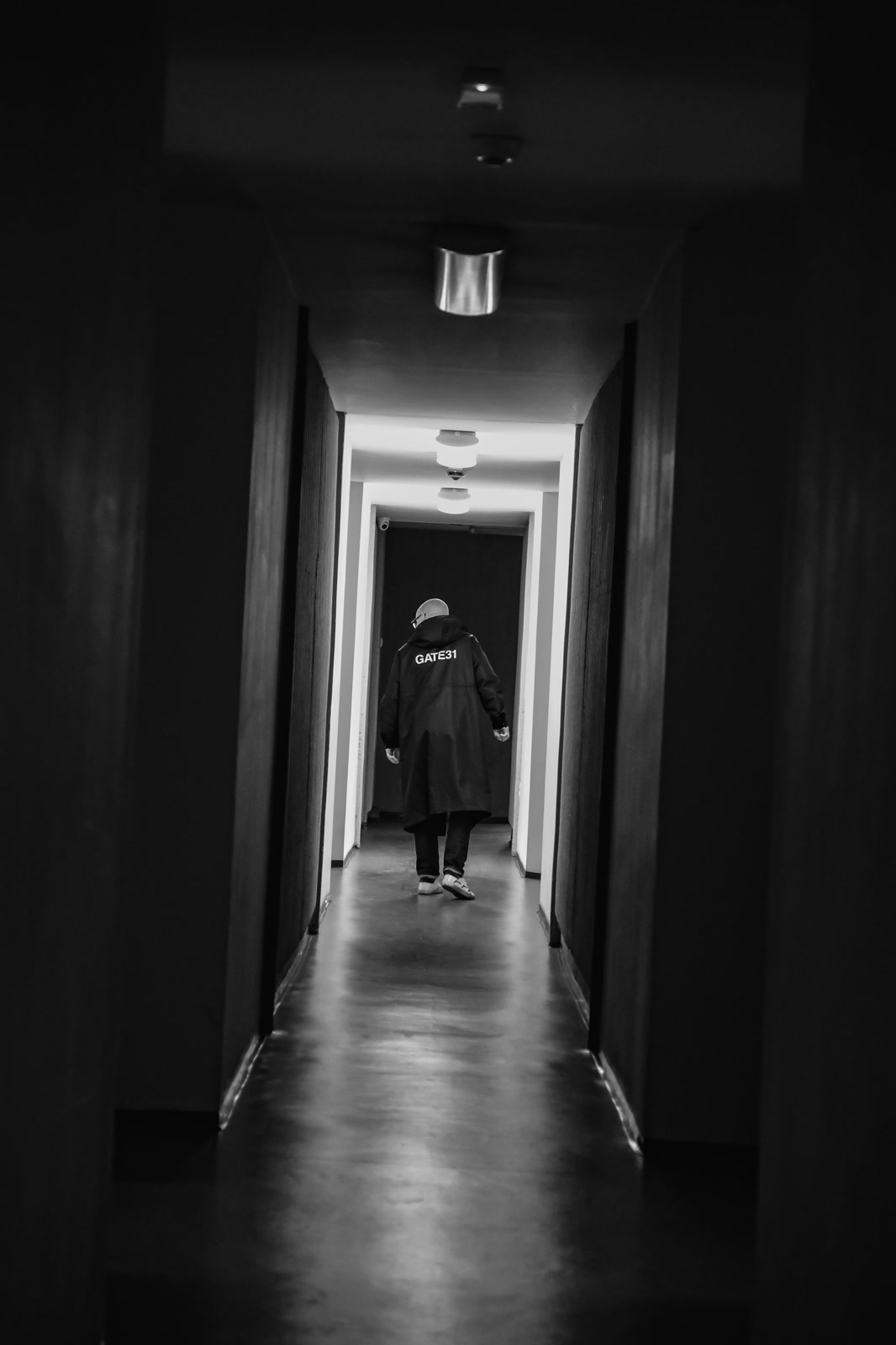 Figure at the far end of a dark corridor